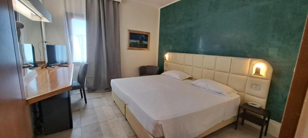 Postel nebo postele na pokoji v ubytování Hotel Delta Florence