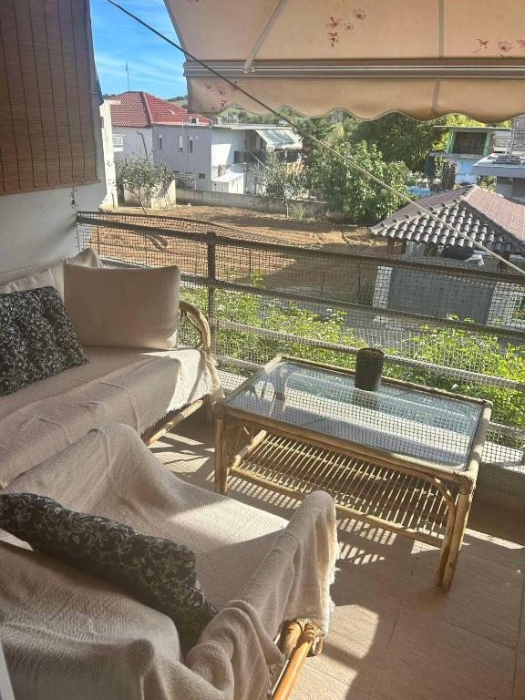 Posezení v ubytování Flat in Makrygialos