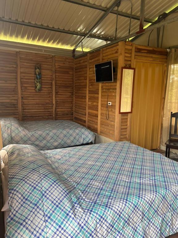 Postel nebo postele na pokoji v ubytování Cabañas venado