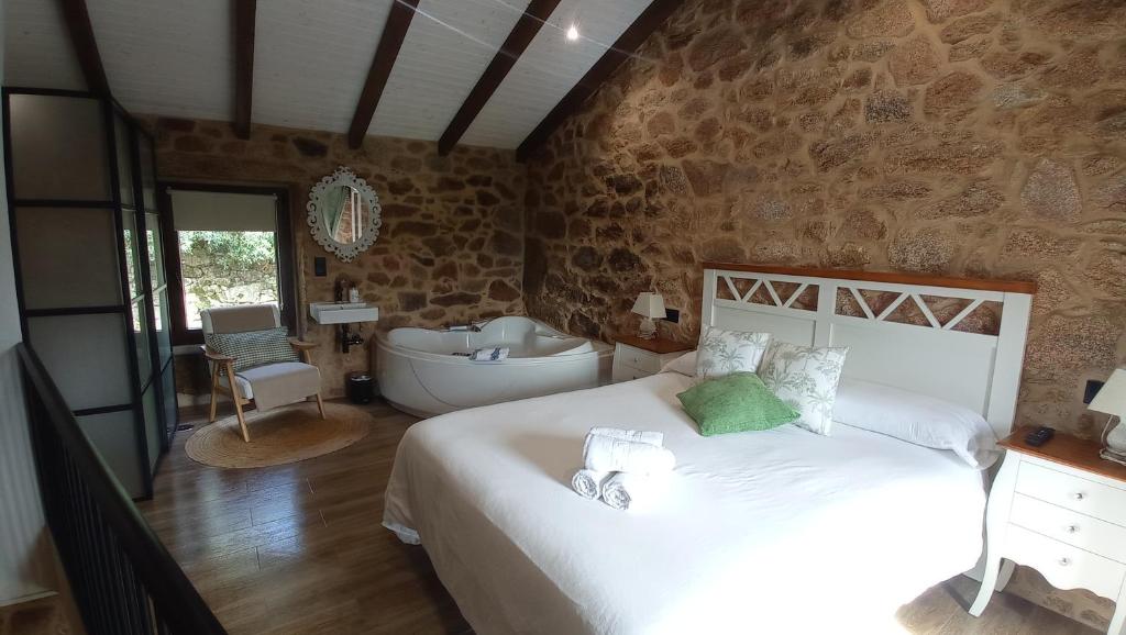 Postel nebo postele na pokoji v ubytování A casiña do Pozo