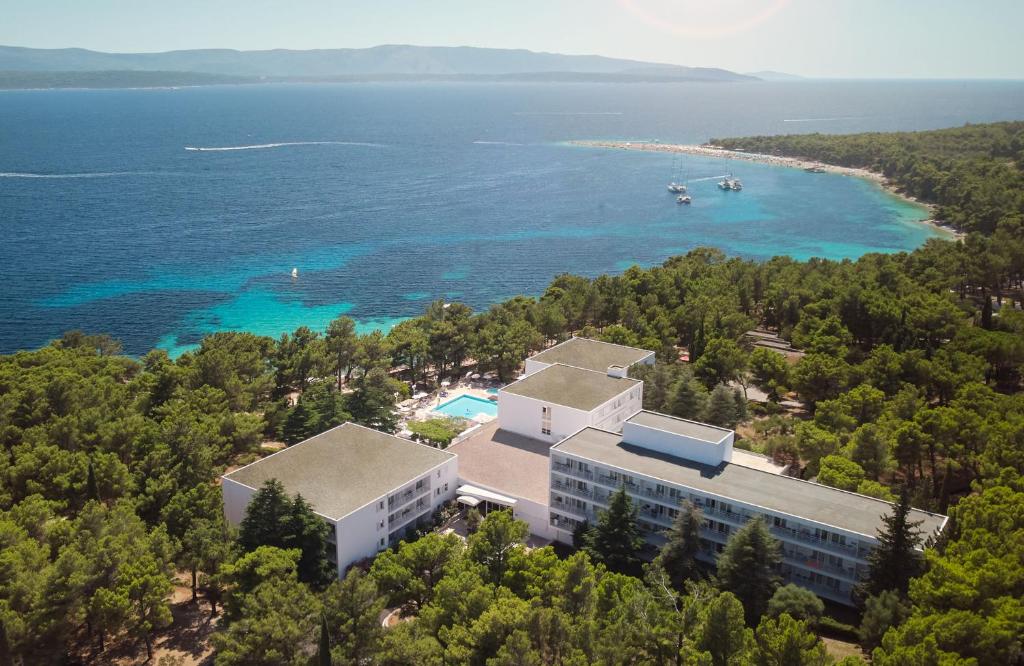 an aerial view of a building and the water at Bluesun Hotel Borak in Bol