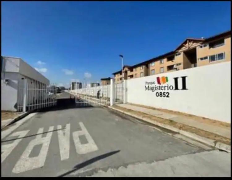 an empty parking lot in front of a building at Acogedor departamento en condominio in Talca