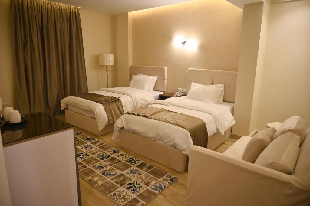 Voodi või voodid majutusasutuse Pyramids Wonders Hotel toas