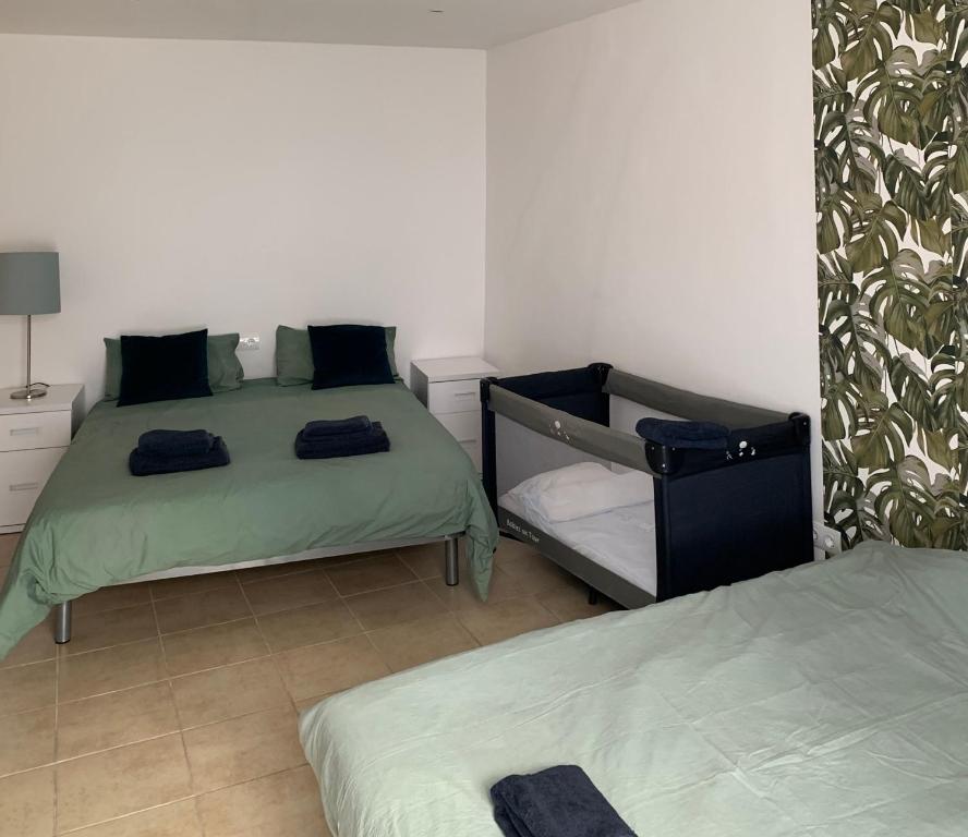 Cama o camas de una habitación en Hostal Casa Michaels