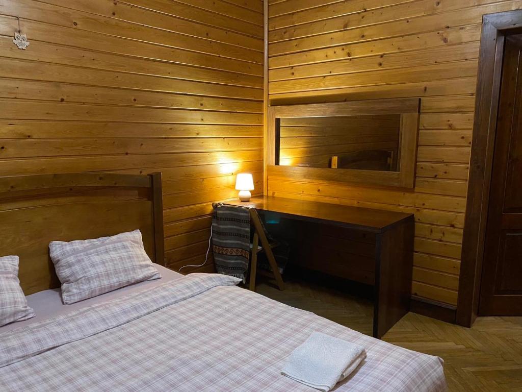 Postel nebo postele na pokoji v ubytování Візерунок