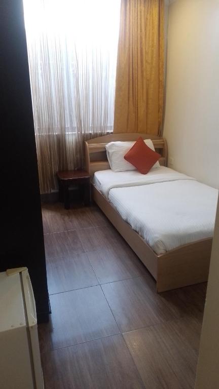 Postel nebo postele na pokoji v ubytování Gigiri Express Hotel