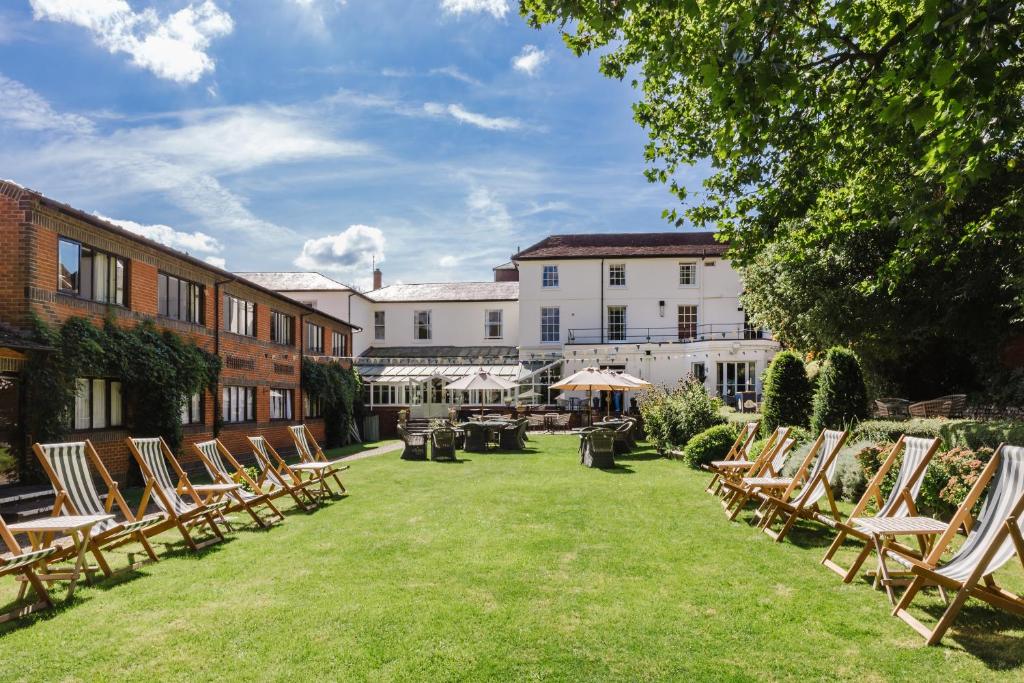 a row of lawn chairs in the courtyard of a hotel at Winchester Royal Hotel in Winchester