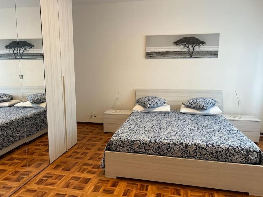 Postel nebo postele na pokoji v ubytování Melide lake apartment
