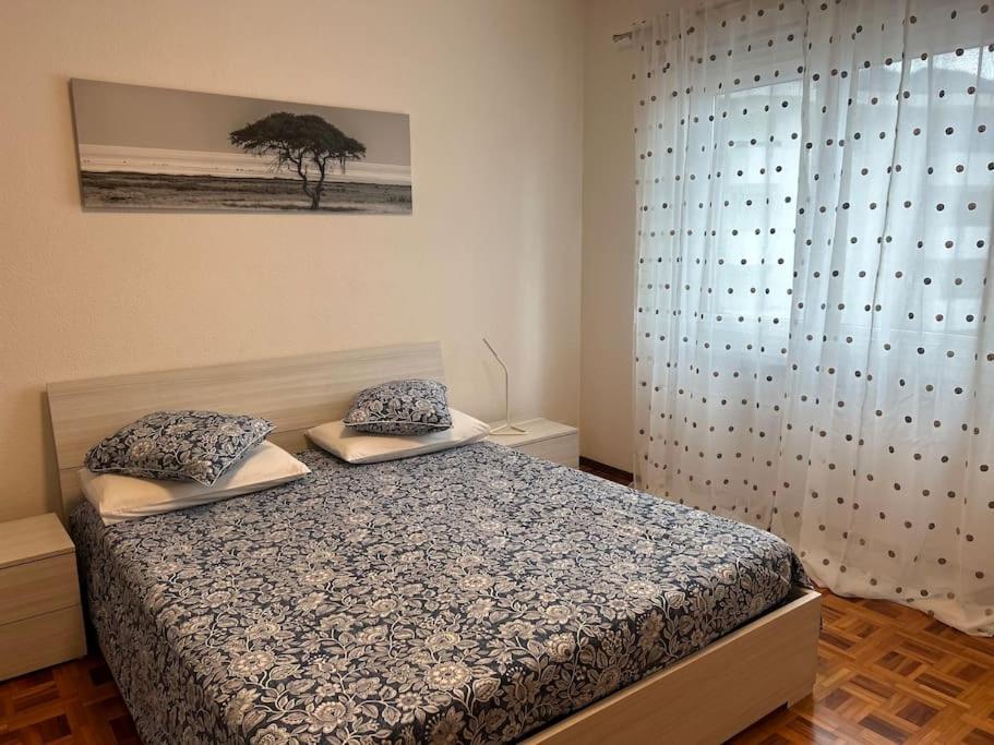 Postel nebo postele na pokoji v ubytování Melide lake apartment