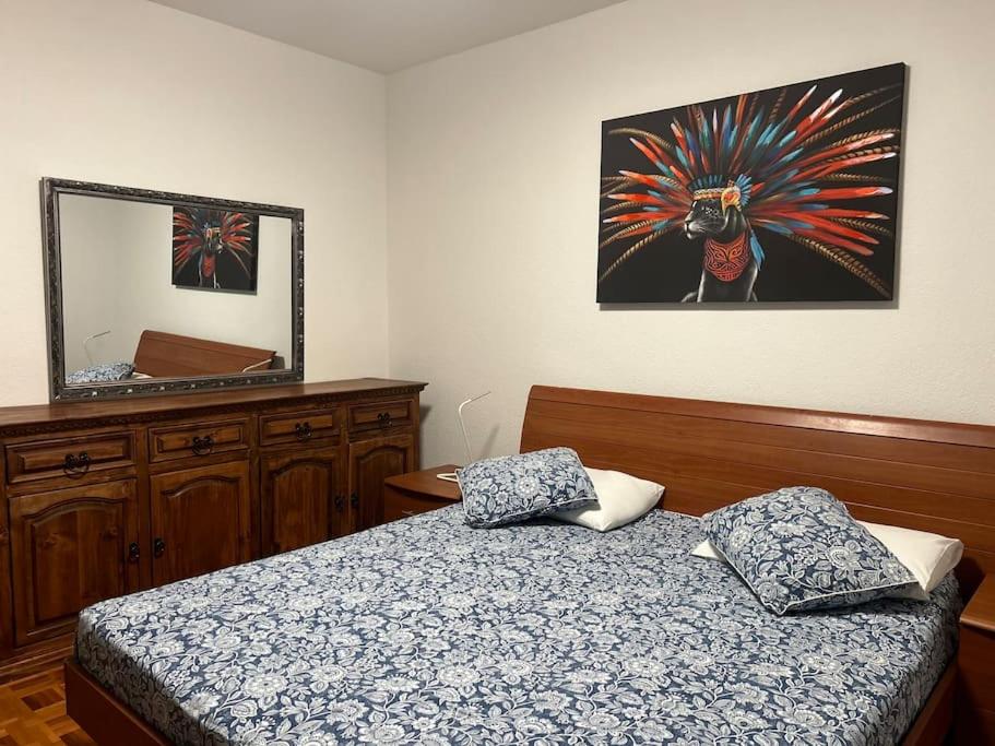 Postel nebo postele na pokoji v ubytování Melide lake apartment