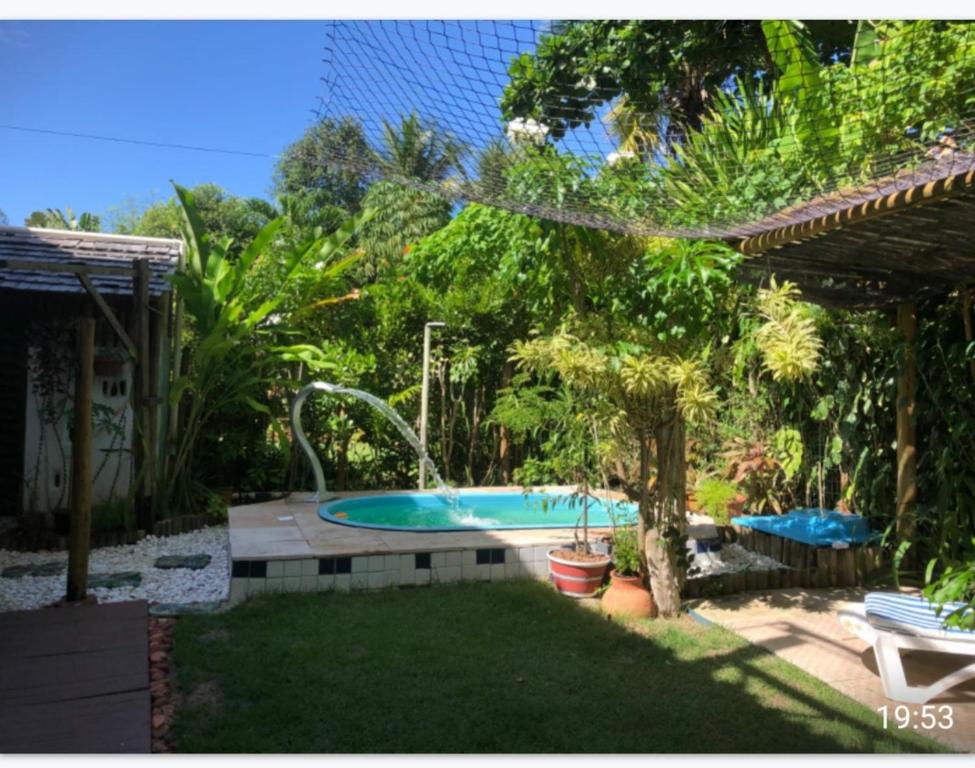 Bazén v ubytování Casa Verde Residence - Piscina , conforto e localização na Praia do Forte nebo v jeho okolí