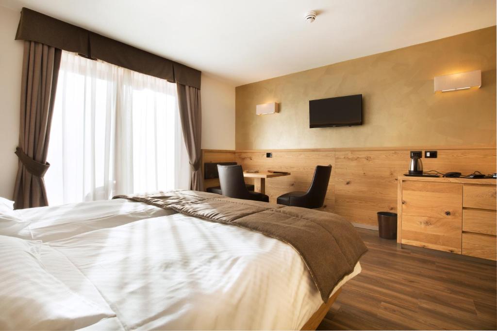 Postel nebo postele na pokoji v ubytování Chalet Marcora