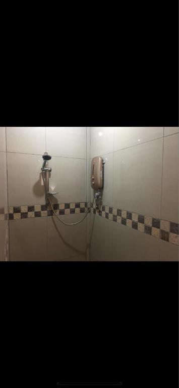 Koupelna v ubytování KJT Travellers Inn