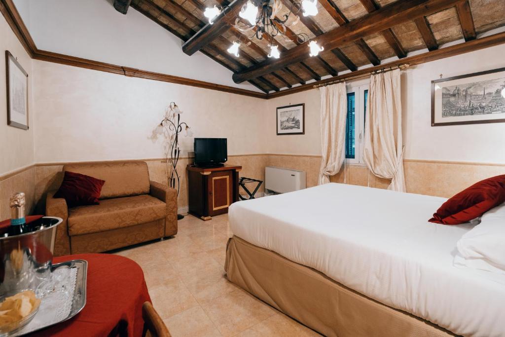 Postel nebo postele na pokoji v ubytování Hotel Pantheon