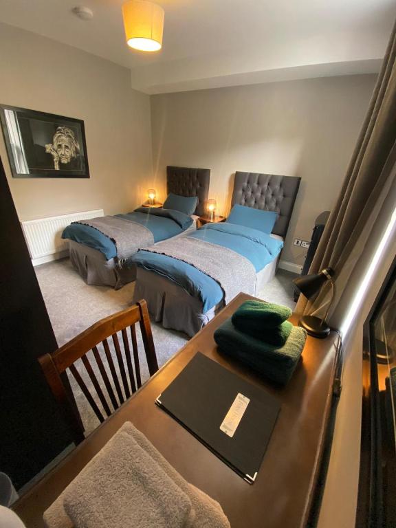 Postel nebo postele na pokoji v ubytování Fern House