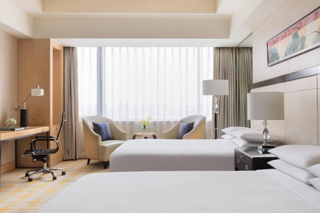 Postel nebo postele na pokoji v ubytování JW Marriott Hotel Beijing