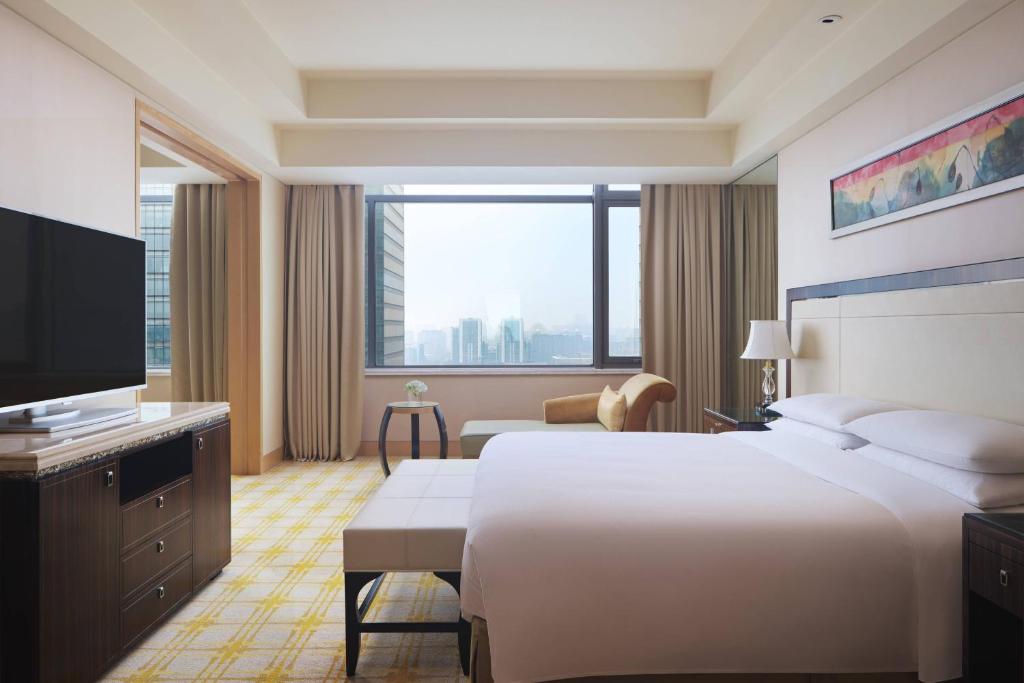 Postel nebo postele na pokoji v ubytování JW Marriott Hotel Beijing