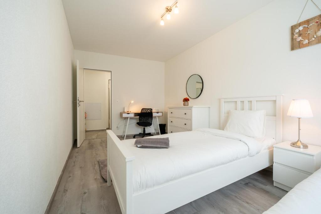 Postel nebo postele na pokoji v ubytování Swiss Suites