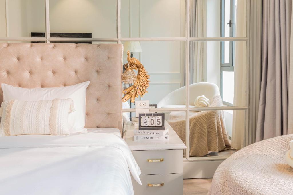 Postel nebo postele na pokoji v ubytování Keypad Hotel - Nhân Hòa