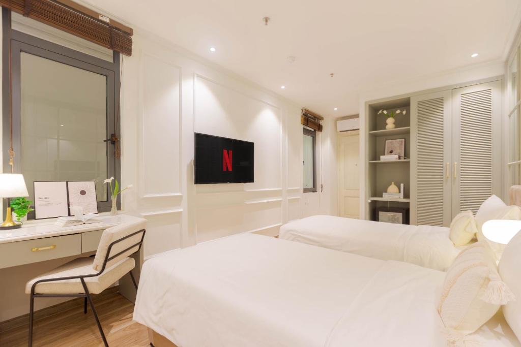 TV a/nebo společenská místnost v ubytování Keypad Hotel - Nhân Hòa