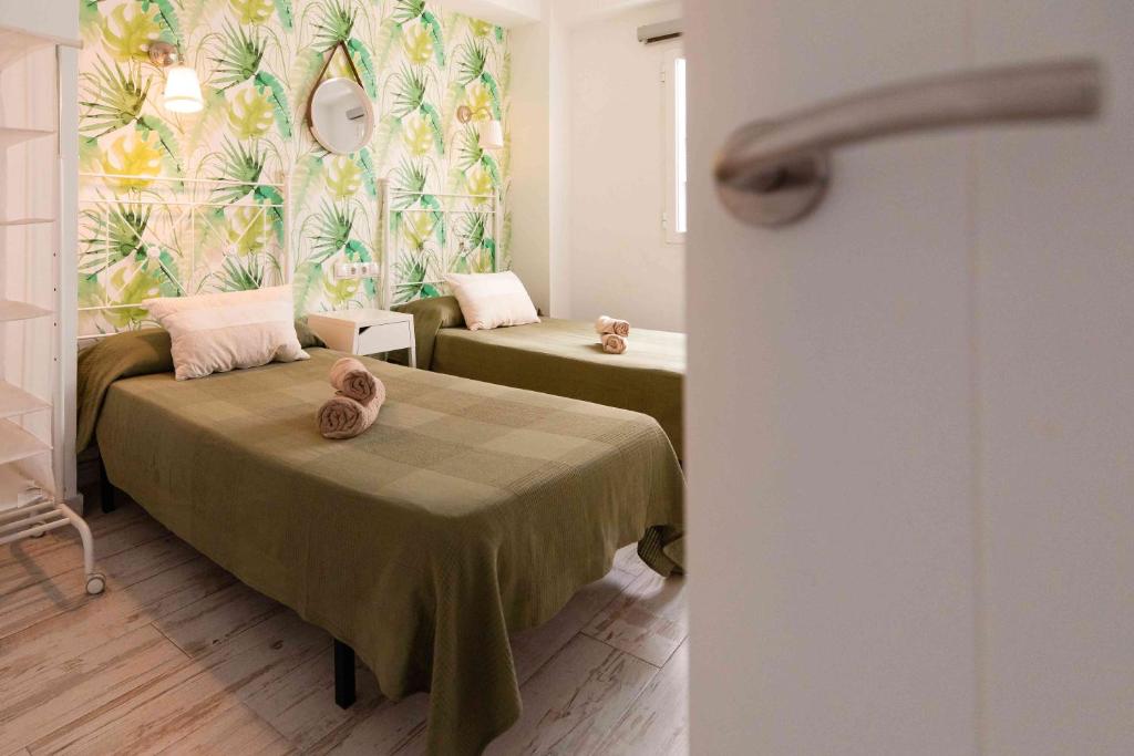 Posteľ alebo postele v izbe v ubytovaní Atico deluxe en el centro by Lets Malaga