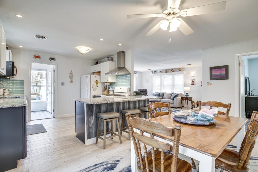 a kitchen and living room with a table and chairs at 4 Mi to Beaches Pet-Friendly Berlin Home! in Berlin
