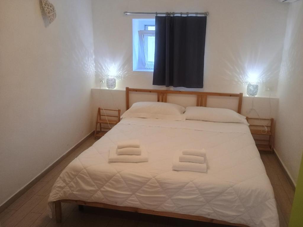 Postel nebo postele na pokoji v ubytování Terrazza Sui Sassi