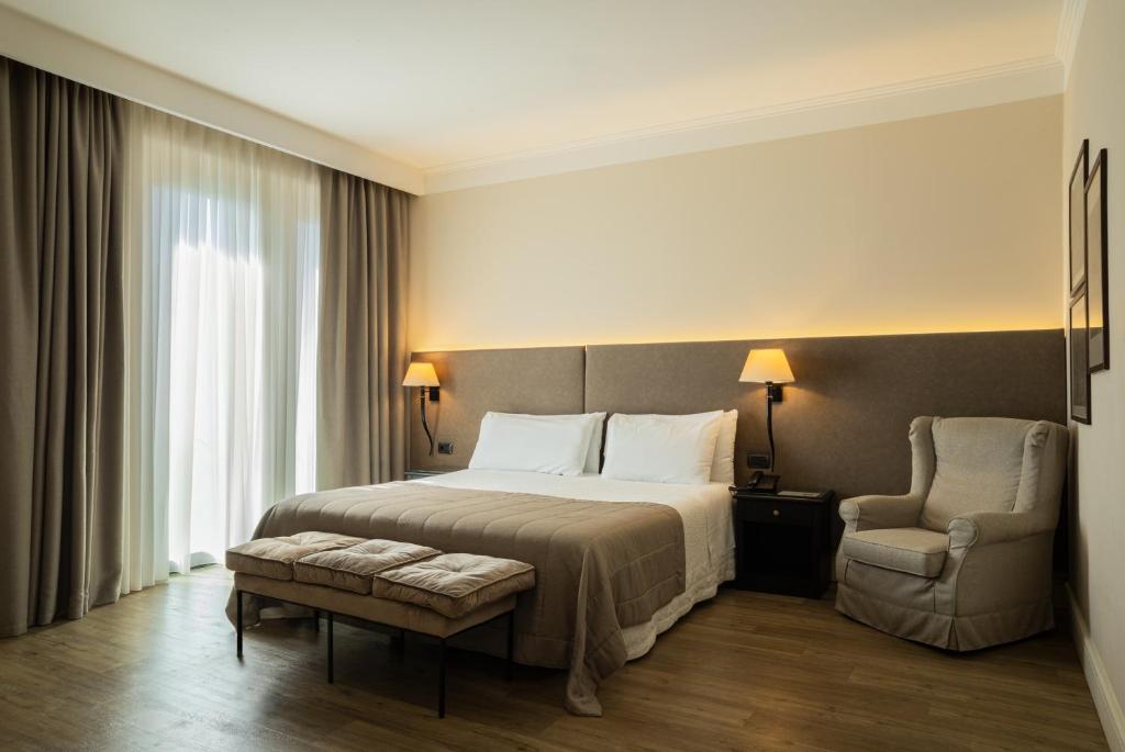 Postel nebo postele na pokoji v ubytování Hotel Touring