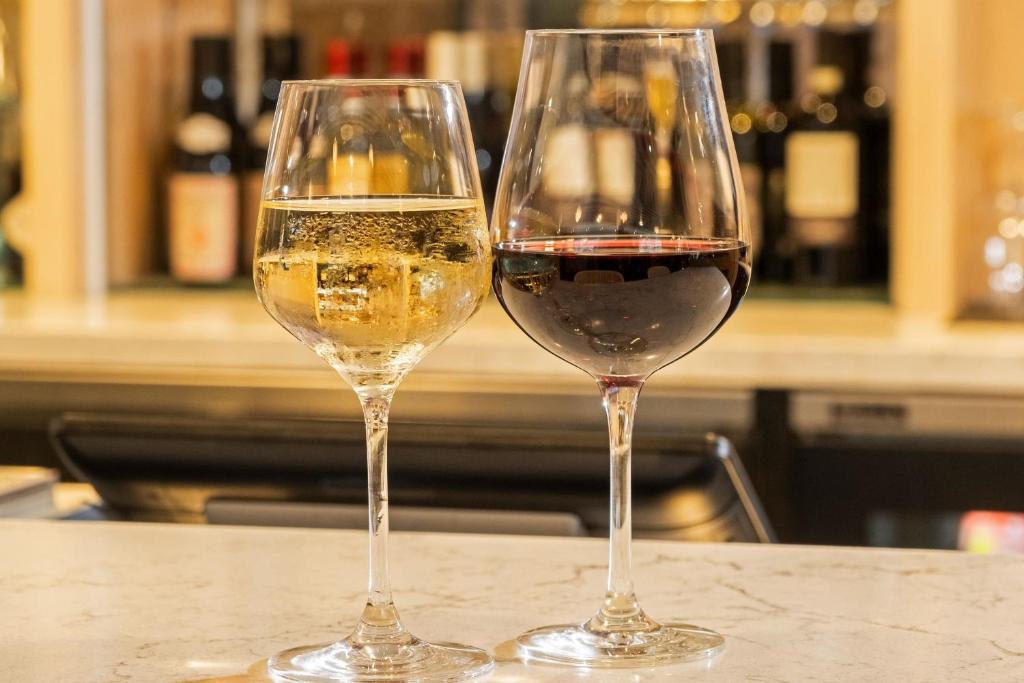two glasses of white wine sitting on a counter at Delta Hotels by Marriott Ottawa City Centre in Ottawa