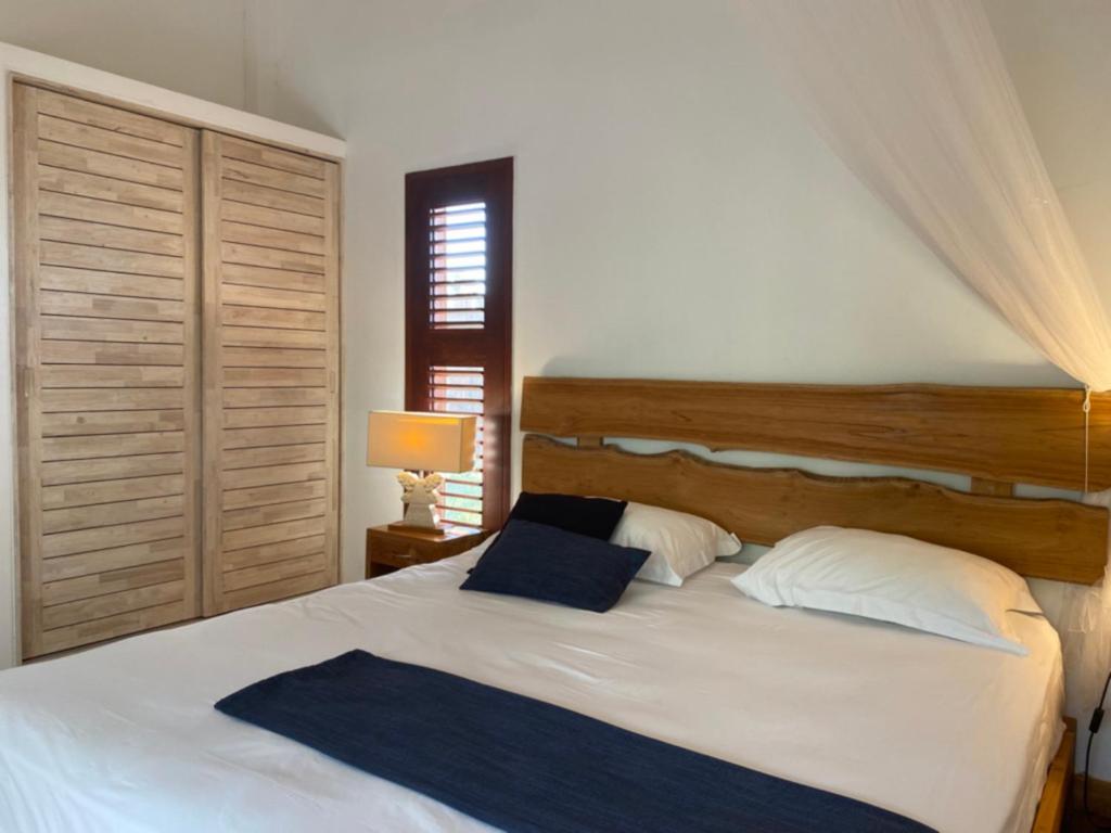 Postel nebo postele na pokoji v ubytování Les Cottages EST et OUEST Coco Cannelle