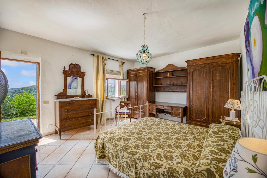 A bed or beds in a room at Torre Del Melograno With Heated Pool - Happy Rentals