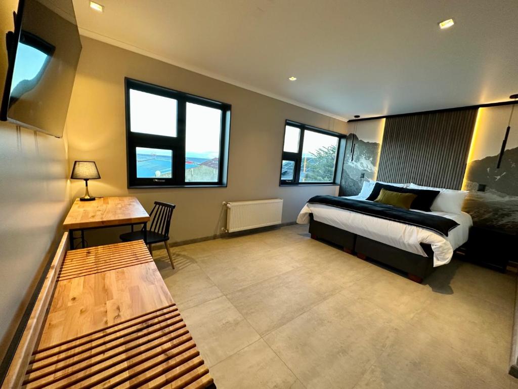 Postel nebo postele na pokoji v ubytování Patagonia Hotel & Apart Suite