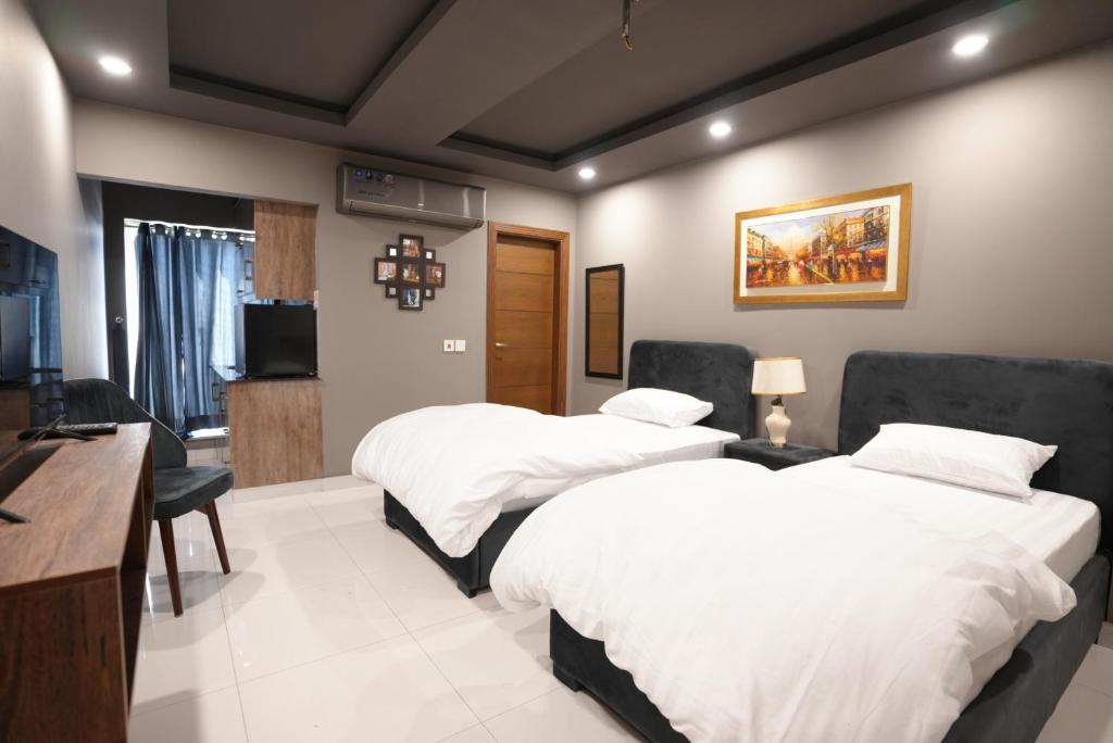 Postel nebo postele na pokoji v ubytování Hotel Crossroads