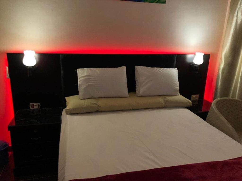 Postel nebo postele na pokoji v ubytování Porto Holiday Hotel & Resort Sharm-ElSheikh