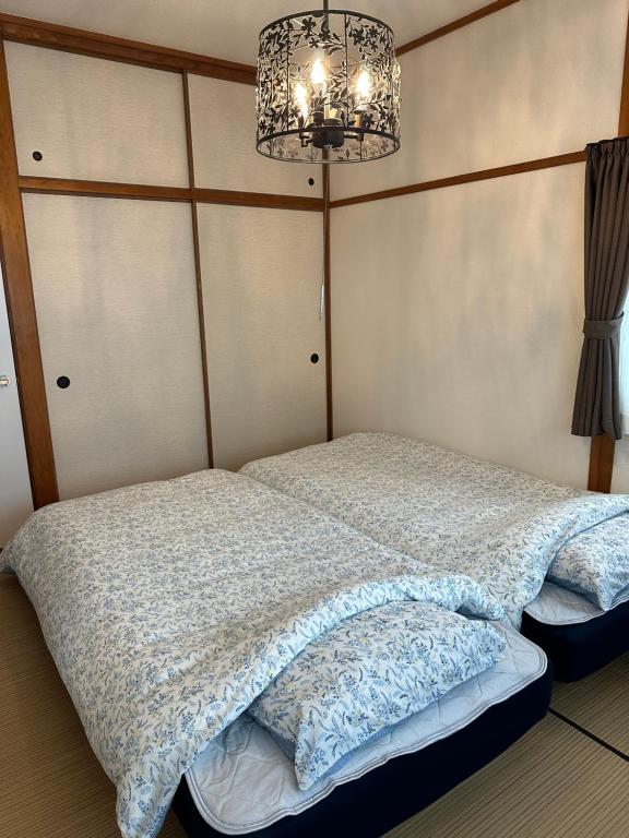 Postel nebo postele na pokoji v ubytování Guest House "Ro"kumano