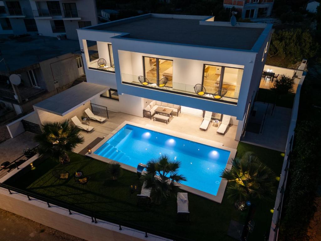 an aerial view of a house with a swimming pool at Luxury villa with a swimming pool Primosten - 23550 in Primošten