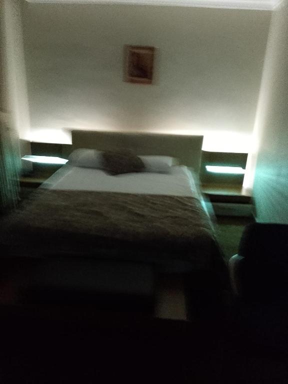 Postel nebo postele na pokoji v ubytování Tac Hotel