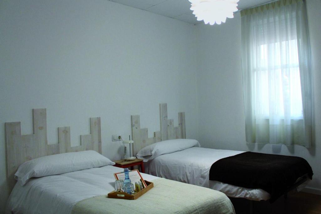 Postel nebo postele na pokoji v ubytování MON ComeySueña Guesthouse