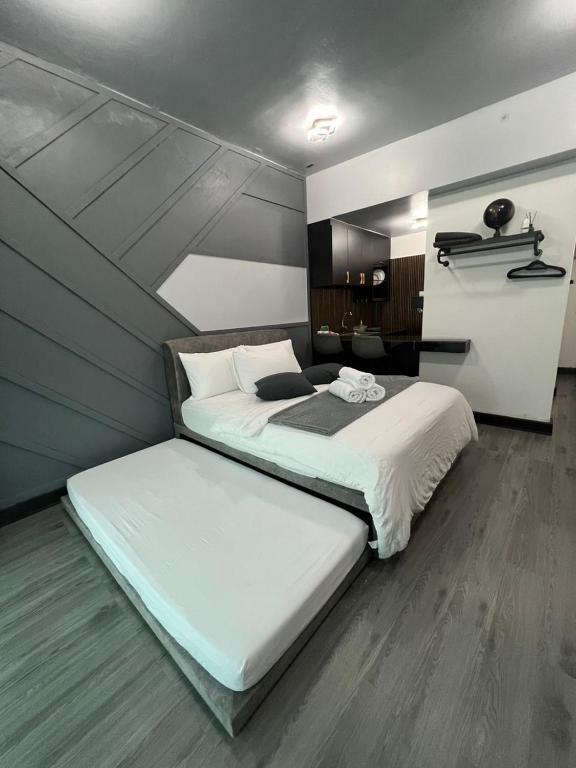 Postel nebo postele na pokoji v ubytování SAMSARA Studio Apartment at Kompleks Mutiara GM