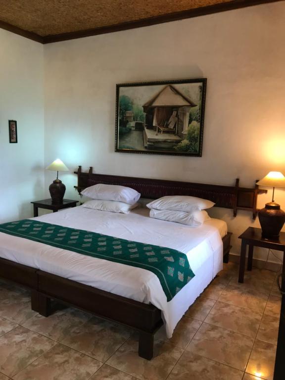 Postel nebo postele na pokoji v ubytování Anomcottages