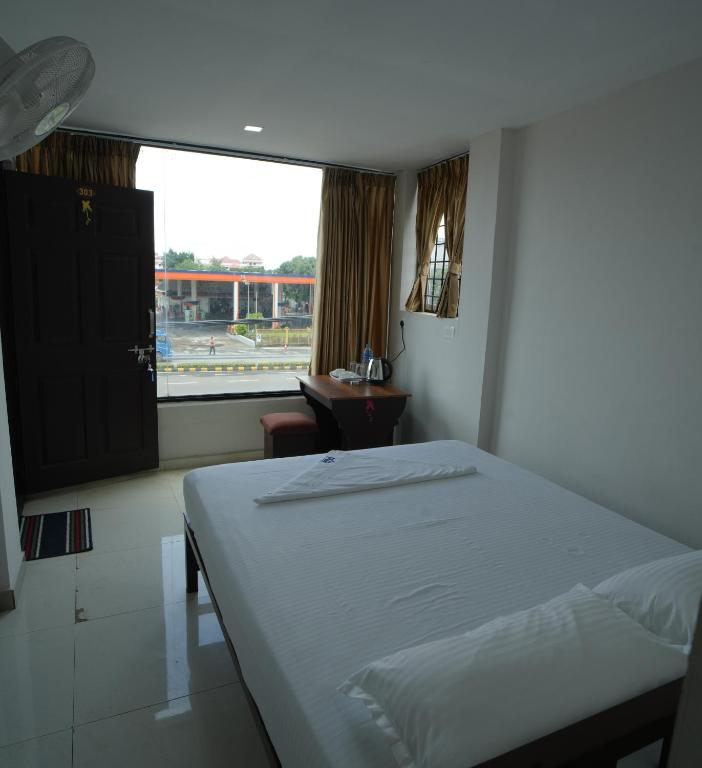Postel nebo postele na pokoji v ubytování Port View Residency PVR