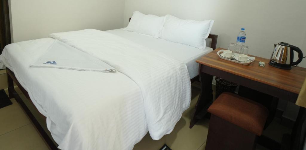 Postel nebo postele na pokoji v ubytování Port View Residency PVR
