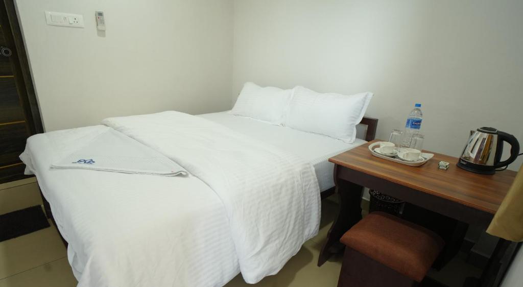 Postel nebo postele na pokoji v ubytování Port View Residency PVR