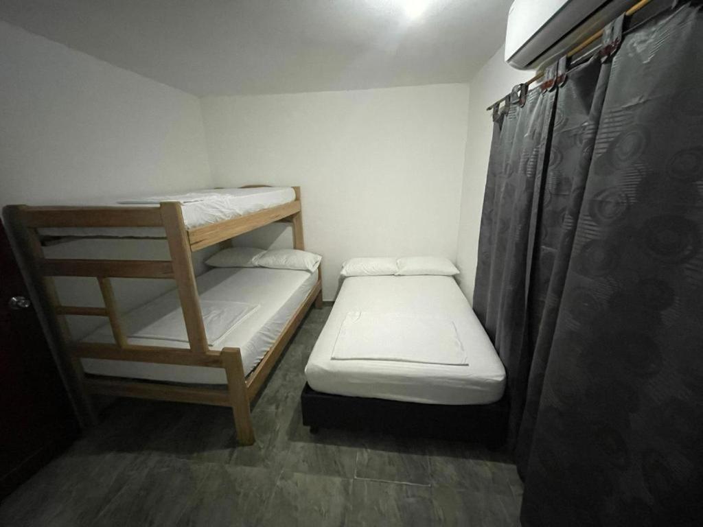 Postel nebo postele na pokoji v ubytování Apartamentos Poseidon