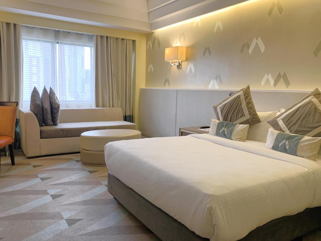 Postel nebo postele na pokoji v ubytování Hotel Benilde Maison De La Salle