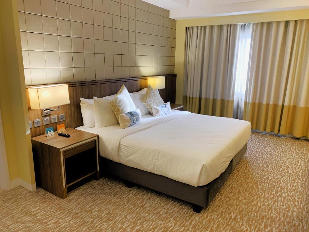 Postel nebo postele na pokoji v ubytování Hotel Benilde Maison De La Salle