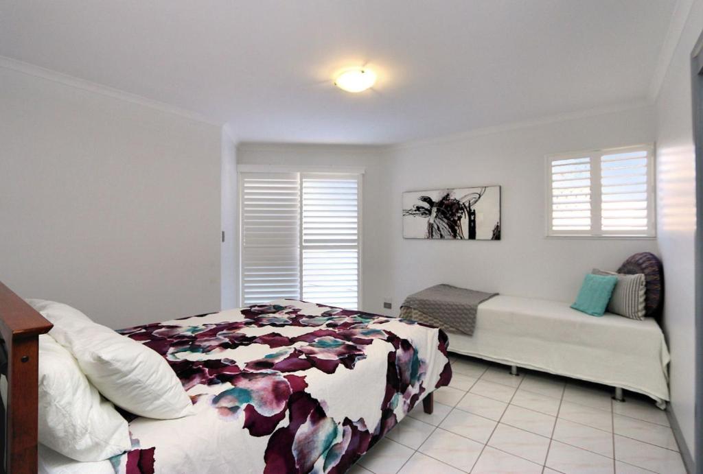 Postel nebo postele na pokoji v ubytování Capricorn Pacific