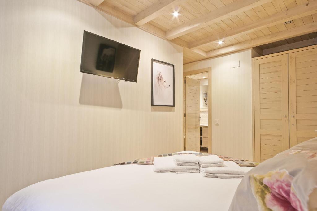 Posteľ alebo postele v izbe v ubytovaní Luderna - Apartamento Val de Ruda B52 dera Montjòia