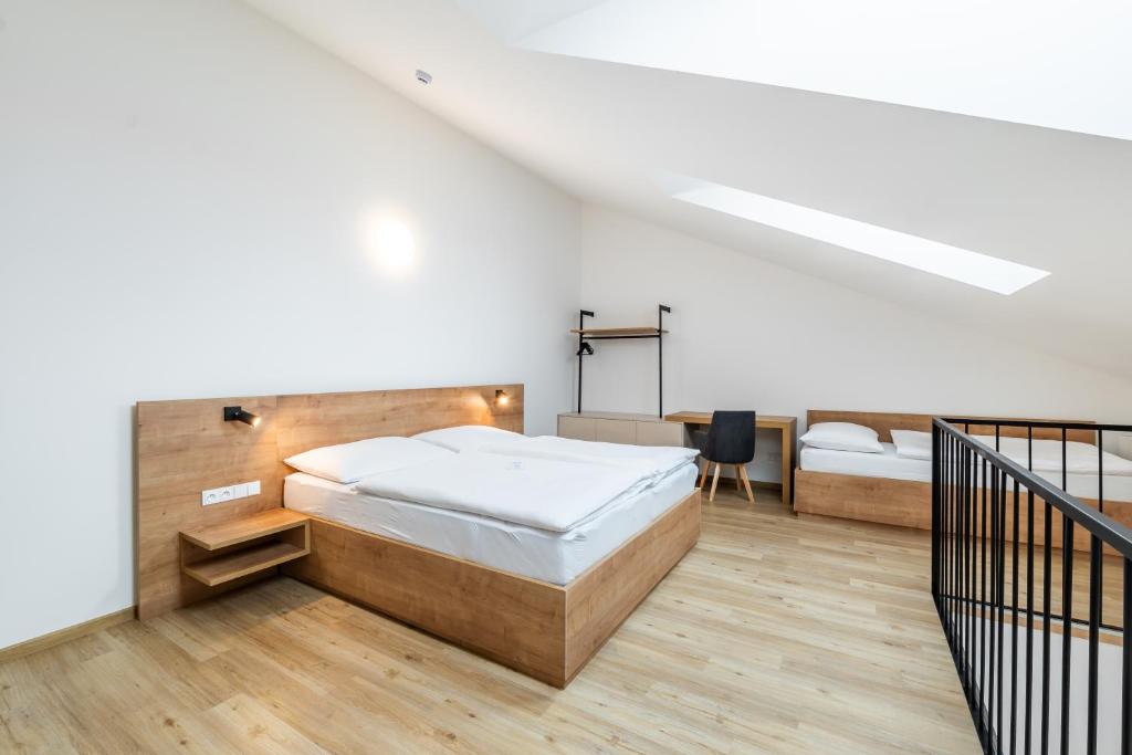 Postel nebo postele na pokoji v ubytování Apartmány Lošov