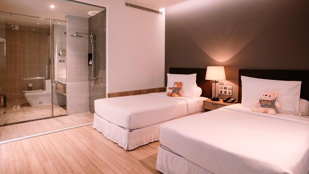 Premium Deluxe Twin Room with Balcony with Free Herbal Foot Bath 15 mins